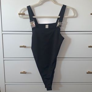Black body suit with buckles